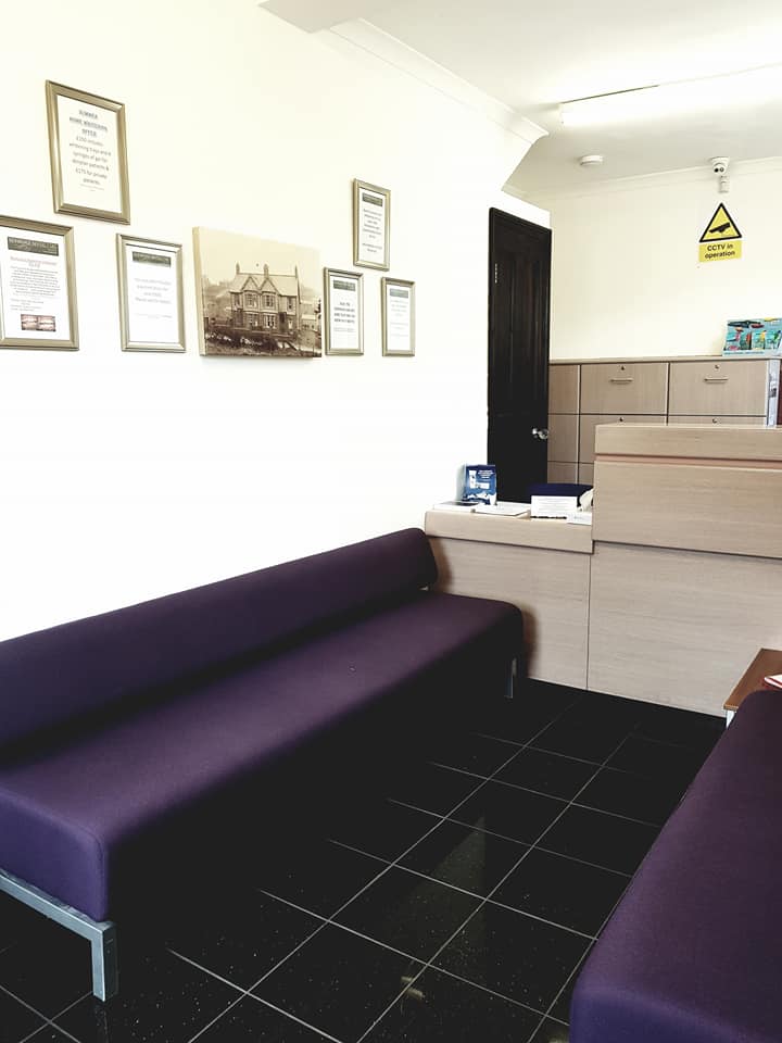 Treatment room with purple sofa